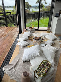 The Pretty Collective - boho style picnic set up DIY hire. Boho rugs, cushions and low tables