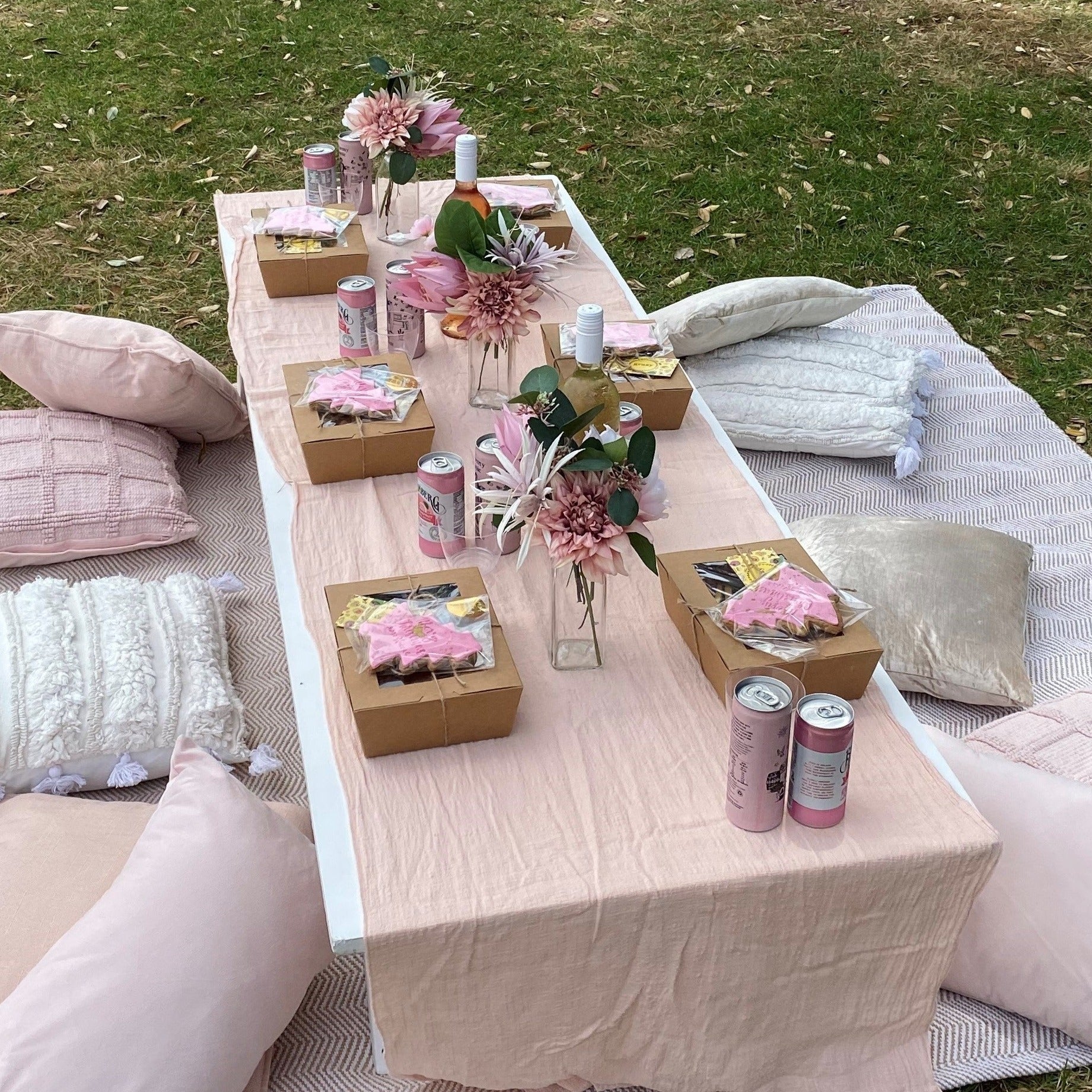 Faux florals on low picnic table 