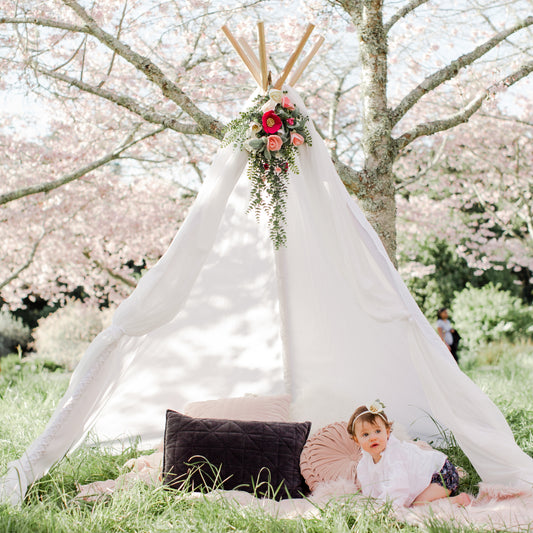 Grande teepee with baby - floral topper and cushions available for hire